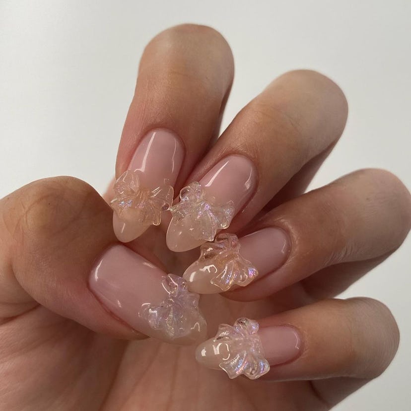 Bubble bath nails with three-dimensional ribbons are an on-trend manicure