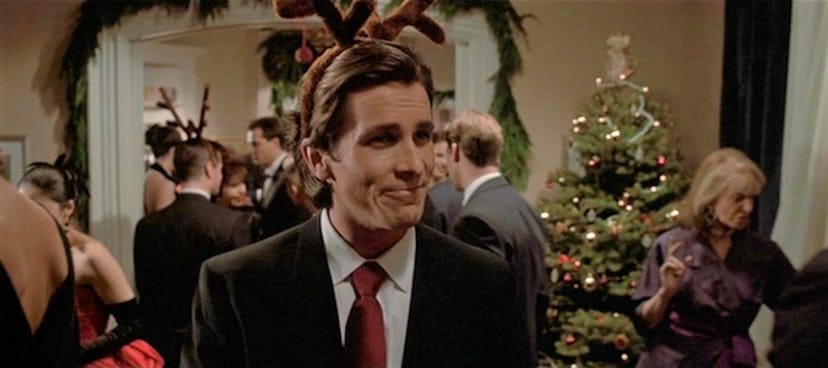 Patrick Bateman wearing reindeer antlers at a Christmas party in 'American Psycho.'