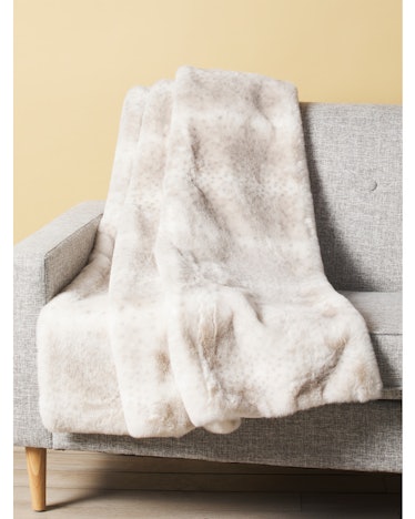 This faux fur throw is one of the spring home decor trends embracing comfort.