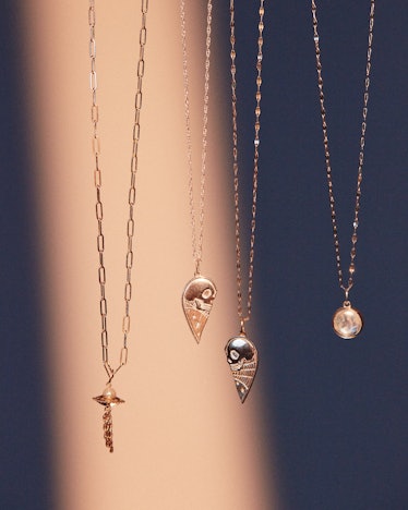 necklaces designed by the musician phoebe bridgers for the brand catbird, featuring moonstone, skull...