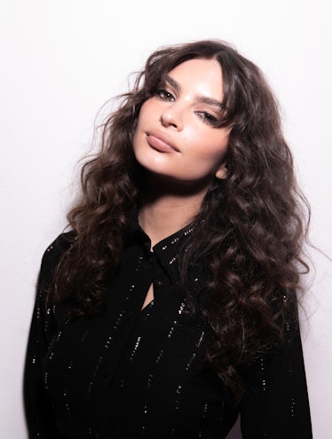 Emily Ratajkowski with curly hair at NYFW in February 2023.