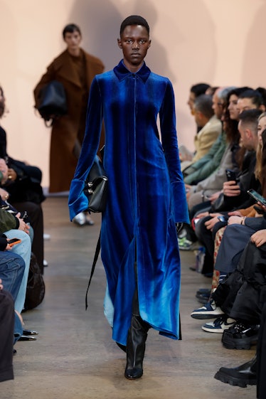 a model in a blue velvet suit
