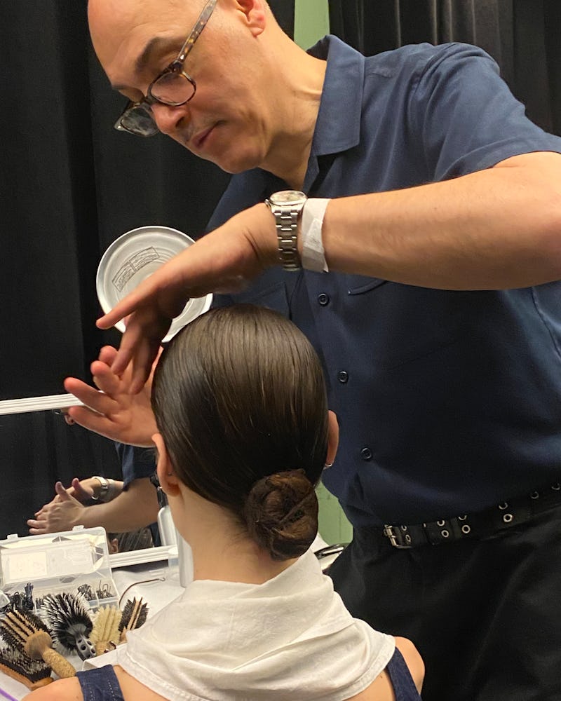 Olaplex Ambassador Jimmy Paul styling a model's hair backstage at Jason Wu F/W ‘23.