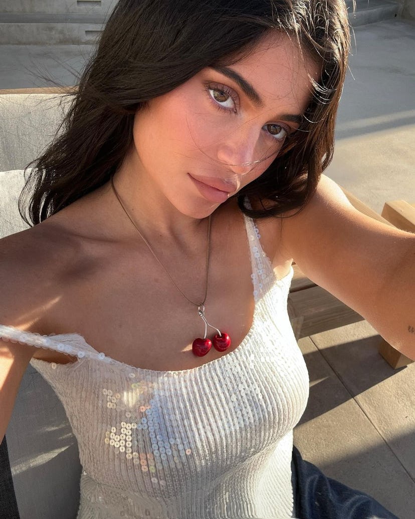 Kylie Jenner wearing a white bathing suit