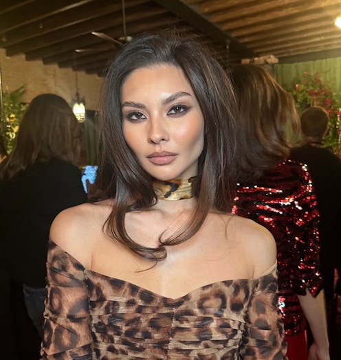 A model wearing smudgy eyeliner and a '90s blowout at the L'Agence F/W '23 presentation.