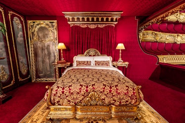 The bedroom in 'The Phantom of the Opera' Airbnb has luxury decor. 