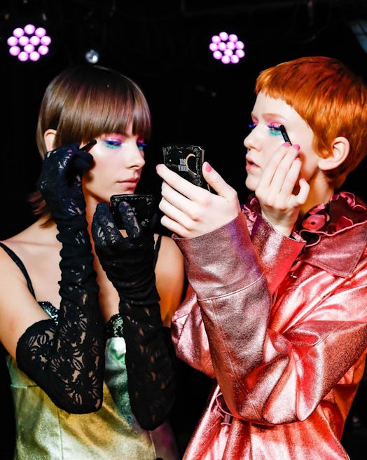 At Anna Sui’s show during New York Fashion Week F/W 2023, the models wore pink & blue eye makeup by …