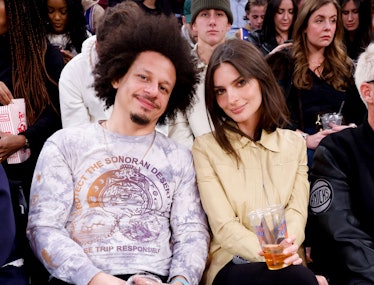 Eric Andre and Emily Ratajkowski sitting with each other at a basketball game