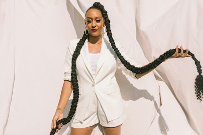 Tia Mowry with a long braid in her 4U by Tia campaign. 