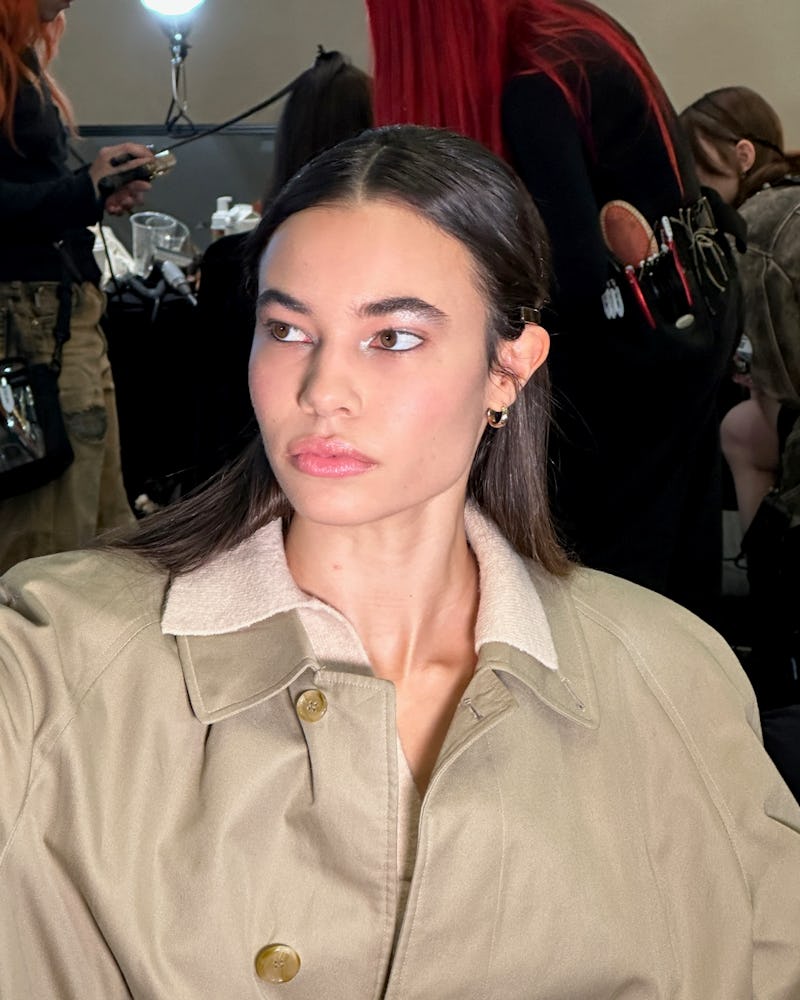 A model backstage at Sandy Liang F/W ‘23. 