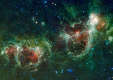 Color image of two nebulae; the one on the right is shaped like an anatomical heart