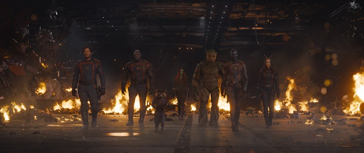 The Guardians walk together through a fiery hangar in Guardians of the Galaxy Vol. 3