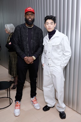 the artist Jammie Holmes and the musician Eric Nam stand together