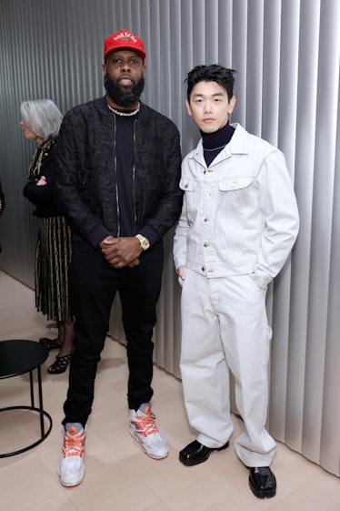 the artist Jammie Holmes and the musician Eric Nam stand together