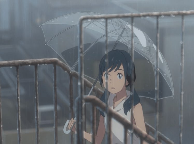 Hina from Weathering with You holds an umbrella during a rainstorm