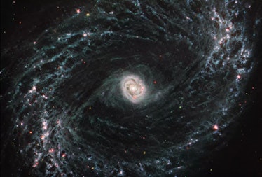 There are two bright regions in this galaxy view: the center is aglow, and the outer edge of the gal...