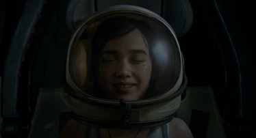 Ellie closes her eyes while wearing an astronaut helmet in The Last of Us Part II