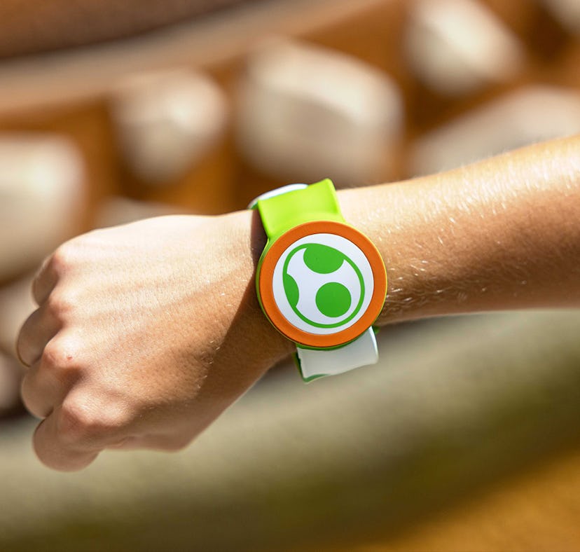 A guest wears a Yoshi Power-Up Band at Super Nintendo World at Universal Studios Hollywood theme par...