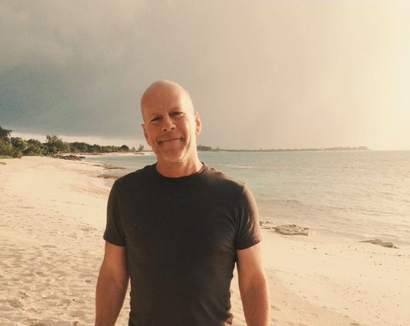 Bruce Willis photographed on the beach.