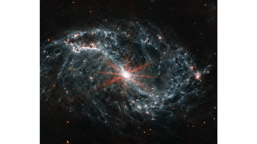 The spiral arms of NGC 7496 are filled with cavernous bubbles and shells overlapping one another in ...