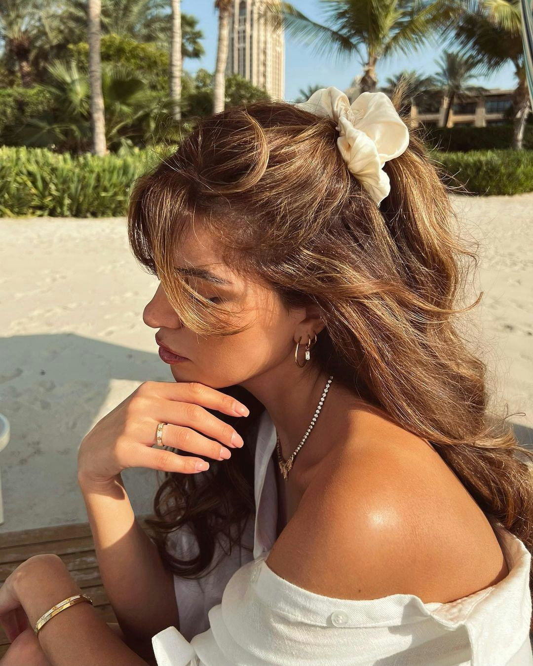 Negin Miraalehi beach waves and curls with claw clip