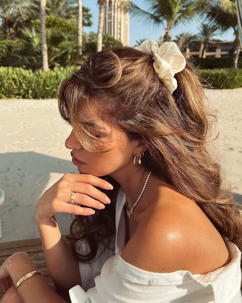Negin Miraalehi beach waves and curls with claw clip