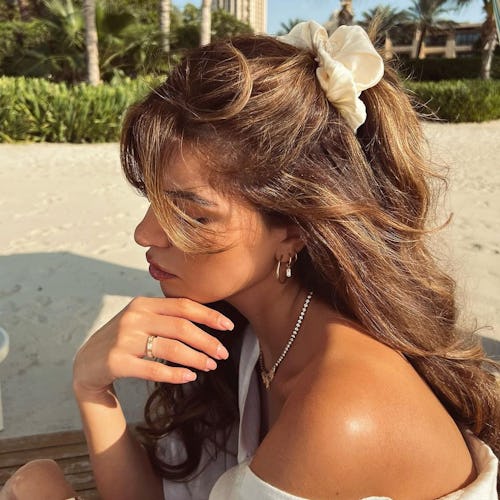 Negin Miraalehi beach waves and curls with claw clip