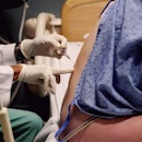 A pregnant person getting an epidural.