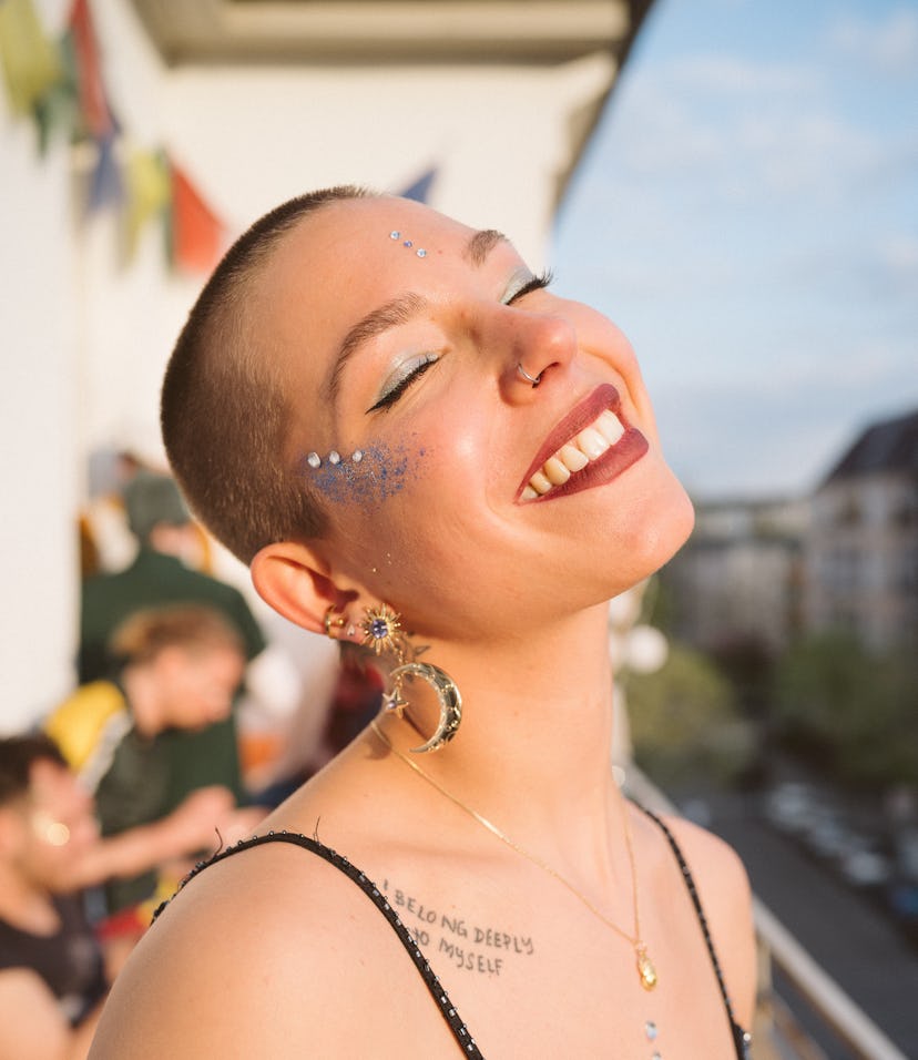 Young woman wearing glitter eye makeup after some helpful tips.