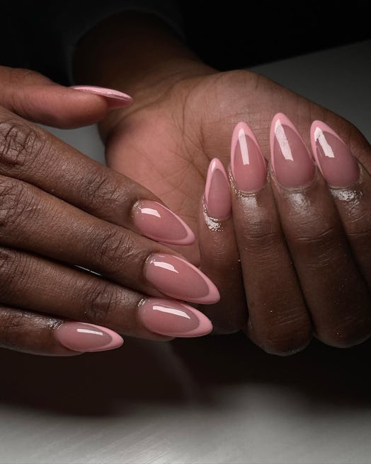 Almond shaped nails with natural nail designs.
