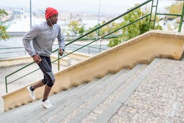 A man running stairs outside.