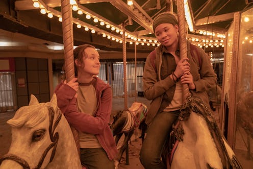 Bella Ramsey as Ellie and Storm Reid as Riley on a merry-go-round in 'The Last of Us' Season 1, Epis...