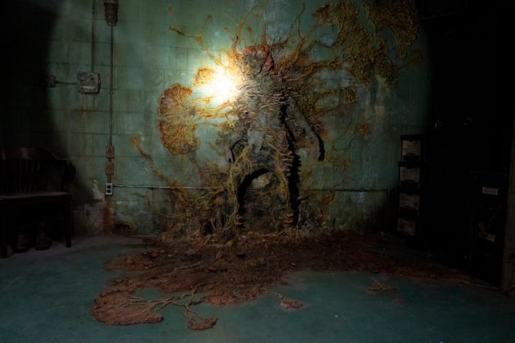 The Last of Us Infected person on the wall with fungi sprouting from their body