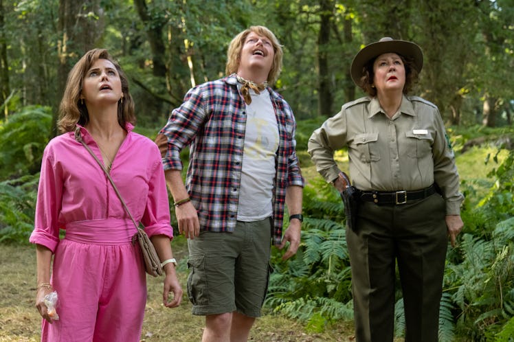 Keri Russell, Jesse Tyler Ferguson, and Margo Martindale stand in the woods in Cocaine Bear