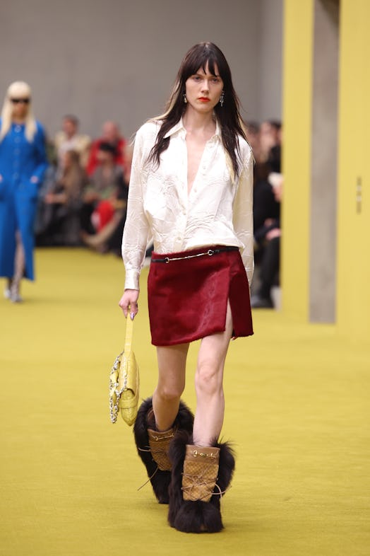 A model walks the runway at the Gucci show during Milan Fashion Week Fall/Winter 2023/24 on February...