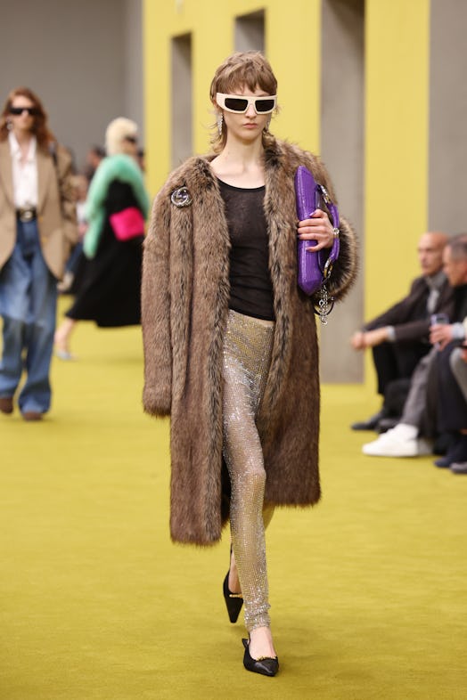 A model walks the runway at the Gucci show during Milan Fashion Week Fall/Winter 2023/24 on February...