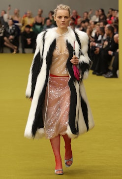 model wearing faux fur coat 