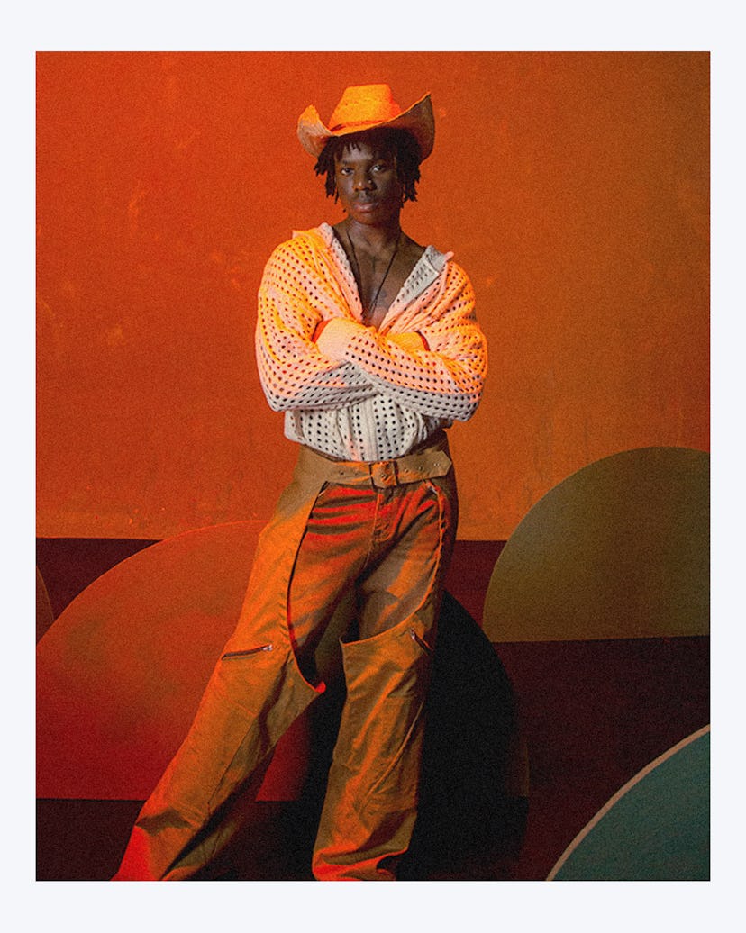 The musician wearing a cowboy-esque outfit