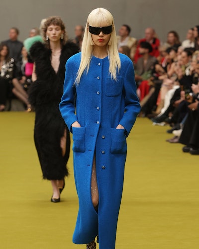 model wearing gucci blue coat
