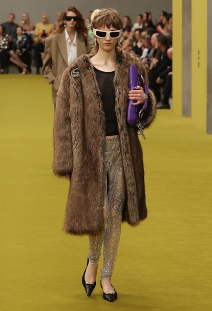 model wearing gucci faux fur coat