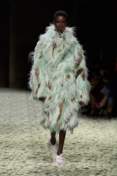 model in a feathered coat