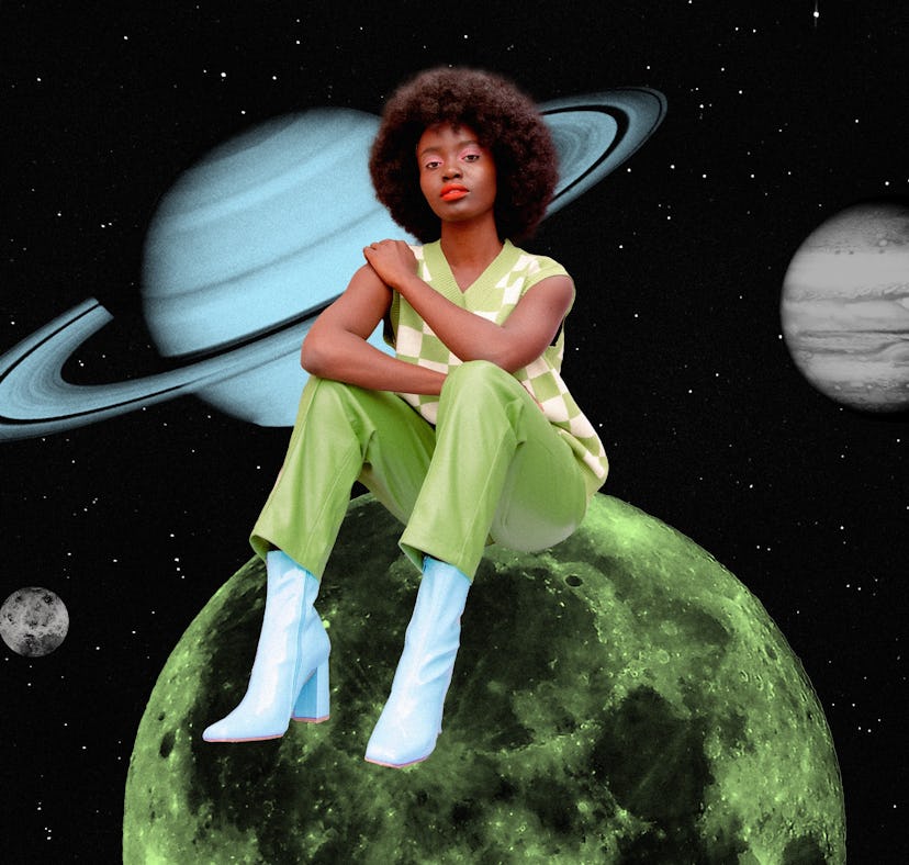 Young woman sitting on a planet after reading her March 2023 horoscope.