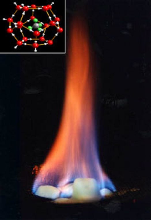 Color image of a pile of ice cubes with flames rising from them, with a molecule diagram inset in th...