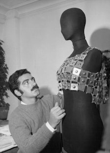 Paco Rabanne in his studio with a mannequin wearing a metal top