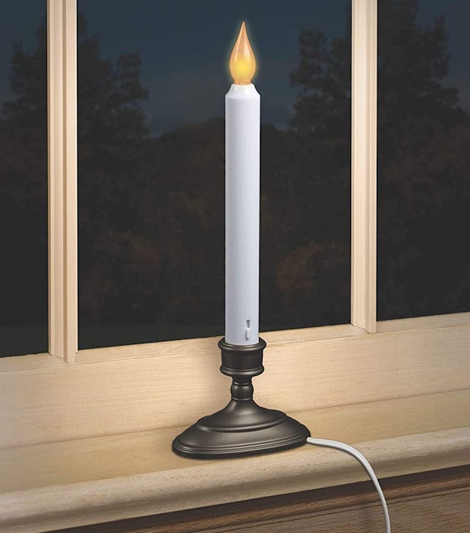 This single window candle comes solo.