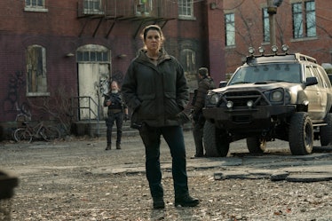 Melanie Lynskey's Kathleen stands near an SUV in The Last of Us Episode 4