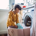 A young girl does laundry