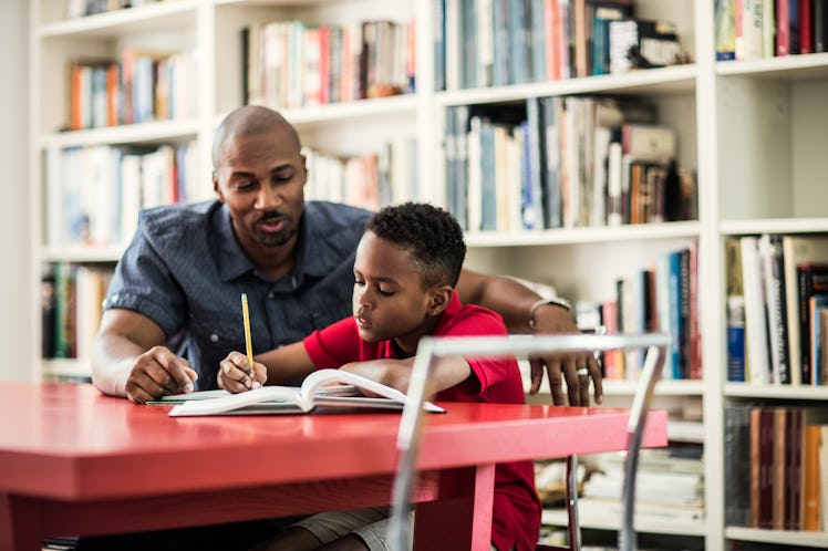 father helping son with homework