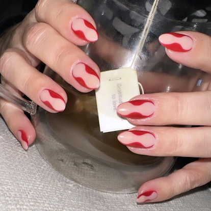 Kourtney Kardashian hourglass red nails by Kim Truong