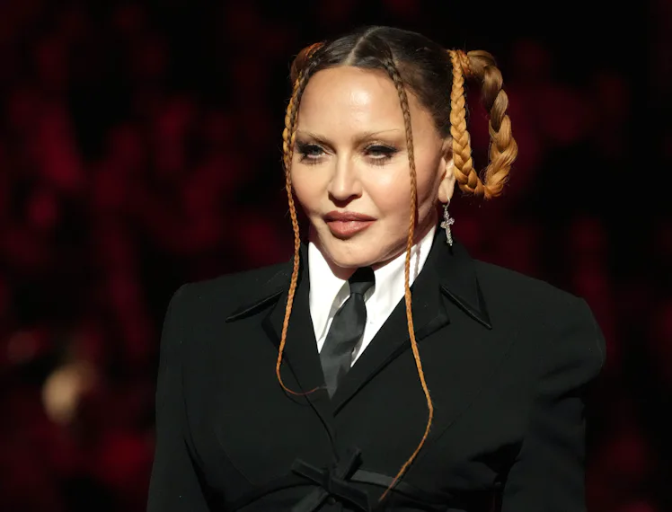 Madonna wearing a black suit